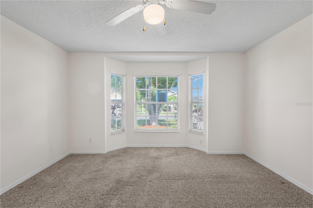 9145 Fort Jefferson Blvd, Orlando, FL 32822 - spare room with carpet flooring, ceiling fan, a textured ceiling, and baseboards