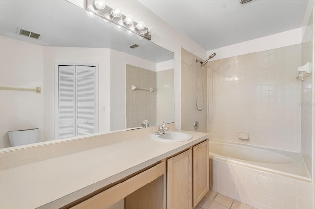 9145 Fort Jefferson Blvd, Orlando, FL 32822 - full bathroom with a closet, tiled shower / bath, vanity, toilet, and tile patterned floors
