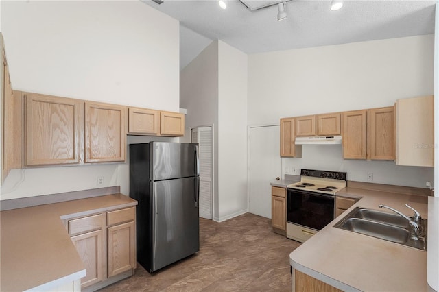 9145 Fort Jefferson Blvd, Orlando, FL 32822 - kitchen with white electric range, freestanding refrigerator, under cabinet range hood, a sink, and high vaulted ceiling