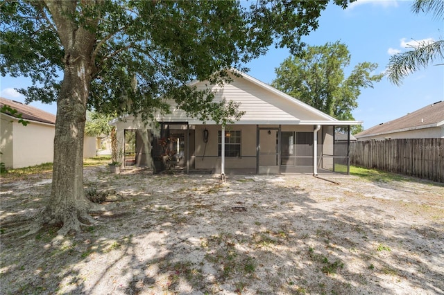 9145 Fort Jefferson Blvd, Orlando, FL 32822 - rear view of house with a sunroom