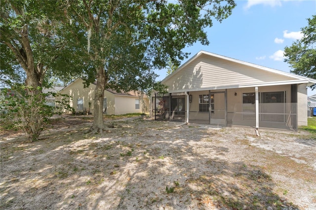 9145 Fort Jefferson Blvd, Orlando, FL 32822 - rear view of property with a sunroom