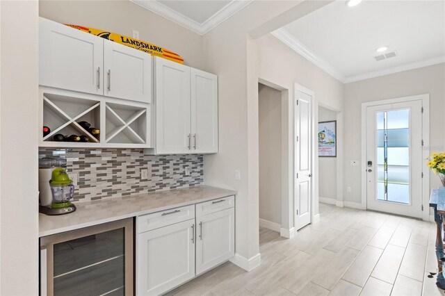 15049 Canopy Cover Dr, Winter Garden, FL 34787 - bar featuring wine cooler, tasteful backsplash, ornamental molding, baseboards, and recessed lighting