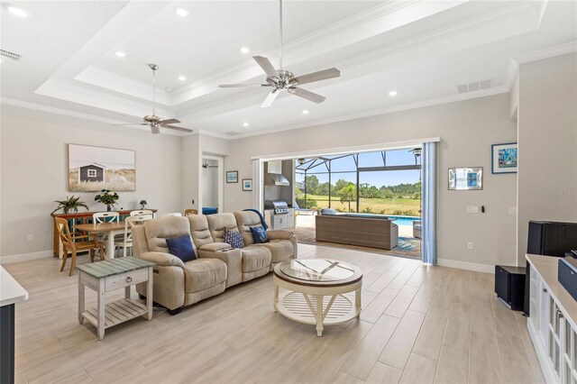 15049 Canopy Cover Dr, Winter Garden, FL 34787 - living room featuring ceiling fan, light wood-style floors, crown molding, recessed lighting, and baseboards