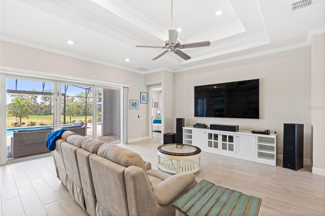 15049 Canopy Cover Dr, Winter Garden, FL 34787 - living room featuring recessed lighting, ceiling fan, baseboards, a raised ceiling, and ornamental molding