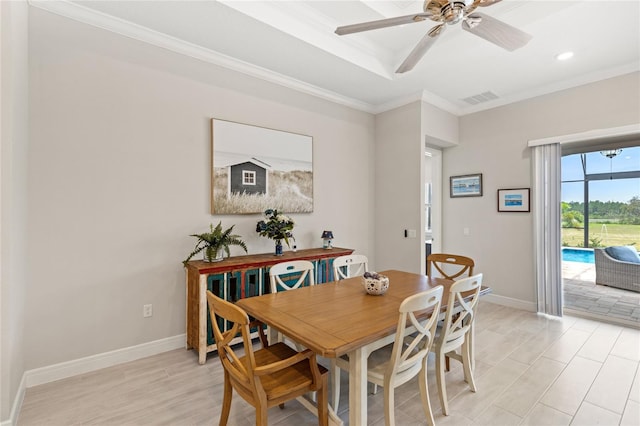 15049 Canopy Cover Dr, Winter Garden, FL 34787 - dining space featuring crown molding, ceiling fan, baseboards, and light wood-style floors