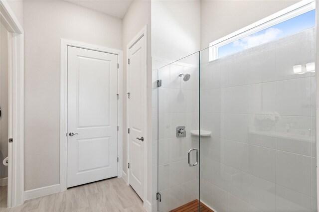 15049 Canopy Cover Dr, Winter Garden, FL 34787 - bathroom featuring a stall shower and baseboards