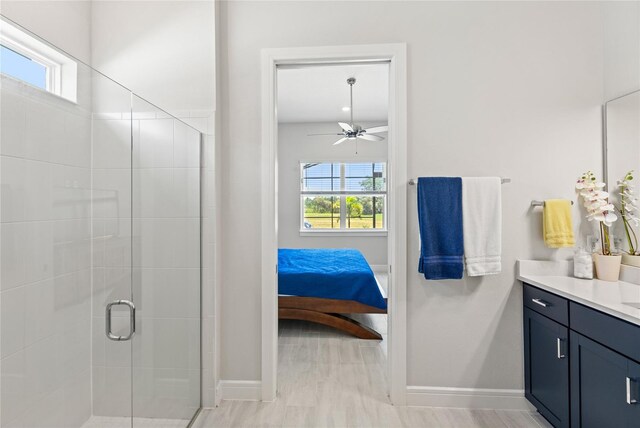 15049 Canopy Cover Dr, Winter Garden, FL 34787 - ensuite bathroom featuring healthy amount of natural light, vanity, a shower stall, and baseboards