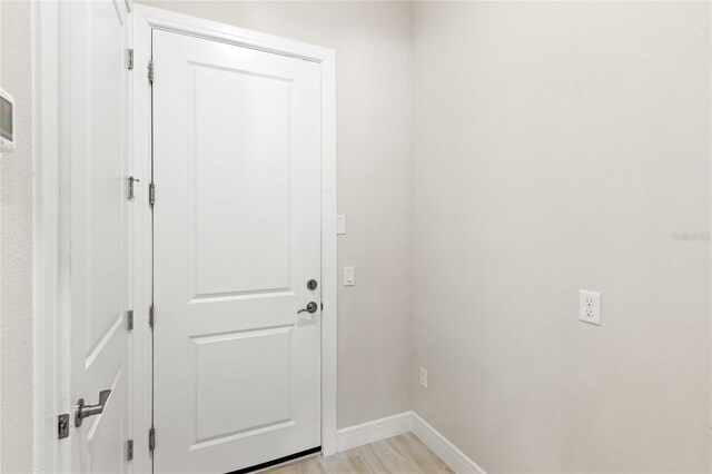 15049 Canopy Cover Dr, Winter Garden, FL 34787 - doorway featuring baseboards and light wood-type flooring