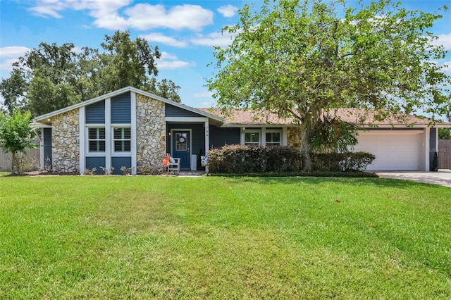 704 Tangerine Ct, Winter Garden, FL 34787 - view of front of house with stone siding, a garage, and concrete driveway