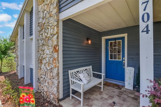 704 Tangerine Ct, Winter Garden, FL 34787 - property entrance featuring a porch and stone siding