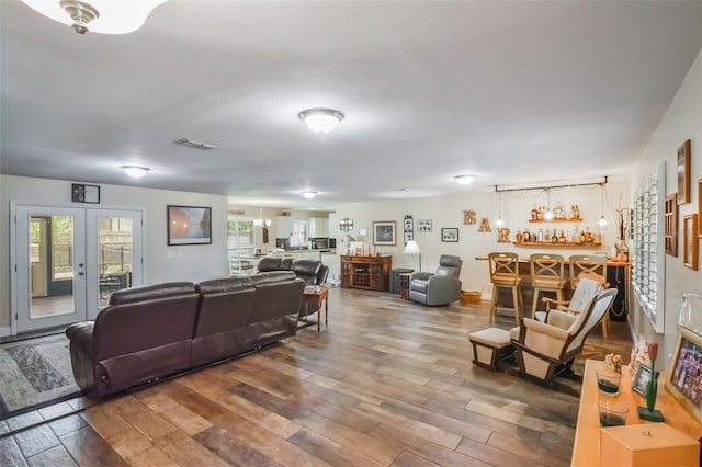 704 Tangerine Ct, Winter Garden, FL 34787 - living room with wood finished floors and a dry bar