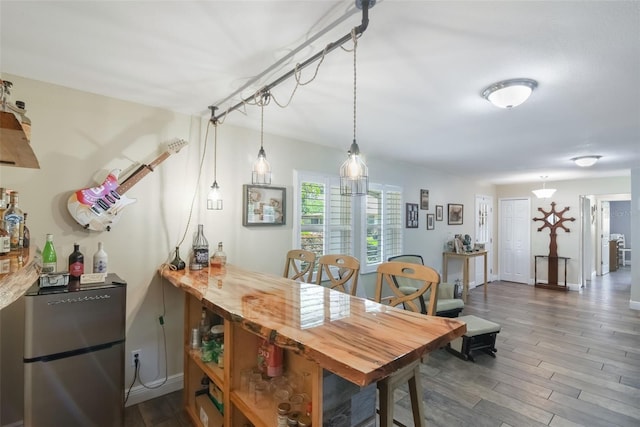 704 Tangerine Ct, Winter Garden, FL 34787 - dining room featuring dark wood-type flooring and baseboards