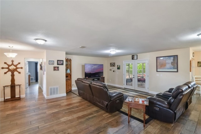 704 Tangerine Ct, Winter Garden, FL 34787 - living area featuring wood-type flooring and baseboards