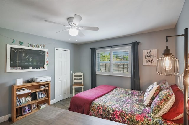 704 Tangerine Ct, Winter Garden, FL 34787 - bedroom featuring baseboards, wood finished floors, ceiling fan, and a closet