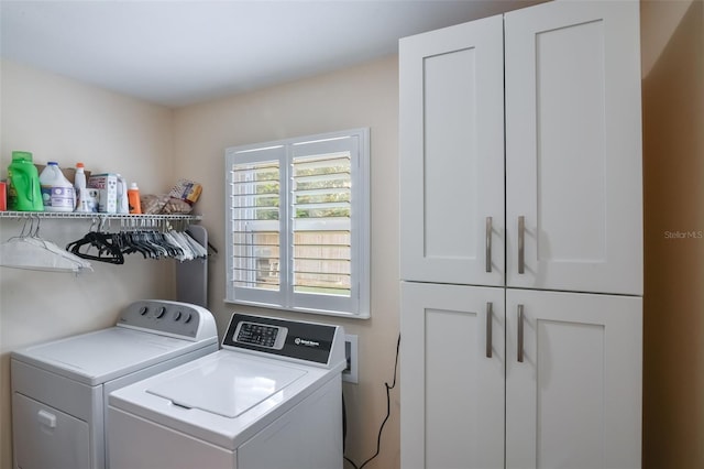 704 Tangerine Ct, Winter Garden, FL 34787 - laundry room with cabinet space and washing machine and dryer