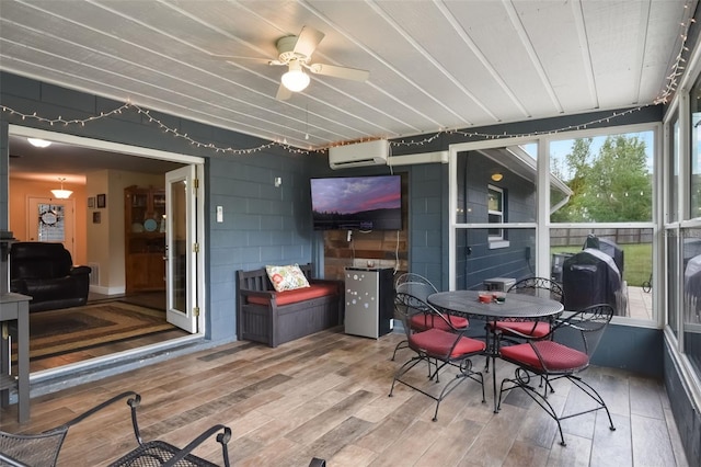 704 Tangerine Ct, Winter Garden, FL 34787 - sunroom featuring a wall mounted air conditioner, a ceiling fan, and outdoor dining area