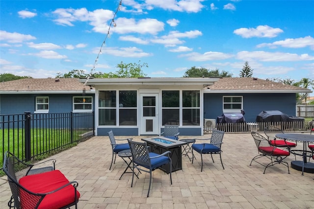704 Tangerine Ct, Winter Garden, FL 34787 - view of patio / terrace with a fire pit, a sunroom, a grill, and outdoor dining space