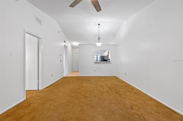 2750 King Oak Cir, Saint Cloud, FL 34769 - spare room with a ceiling fan, carpet, and vaulted ceiling