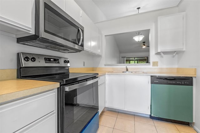 2750 King Oak Cir, Saint Cloud, FL 34769 - kitchen with appliances with stainless steel finishes, light countertops, and white cabinets