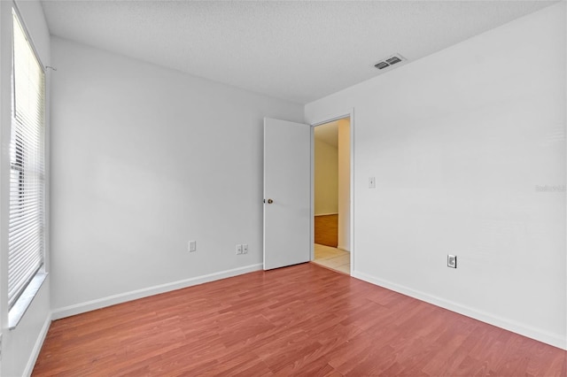 2750 King Oak Cir, Saint Cloud, FL 34769 - empty room featuring wood finished floors and baseboards