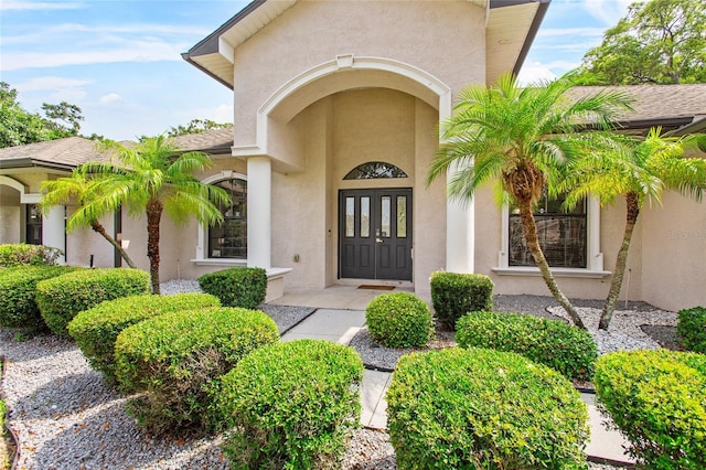 4905 Emilee Grace Ln, Saint Cloud, FL 34771 - property entrance featuring stucco siding and french doors