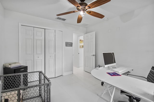 4905 Emilee Grace Ln, Saint Cloud, FL 34771 - bedroom featuring an office area, a closet, ceiling fan, and light tile patterned flooring