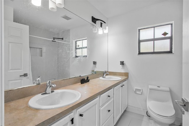 4905 Emilee Grace Ln, Saint Cloud, FL 34771 - bathroom with plenty of natural light, double vanity, toilet, and a shower