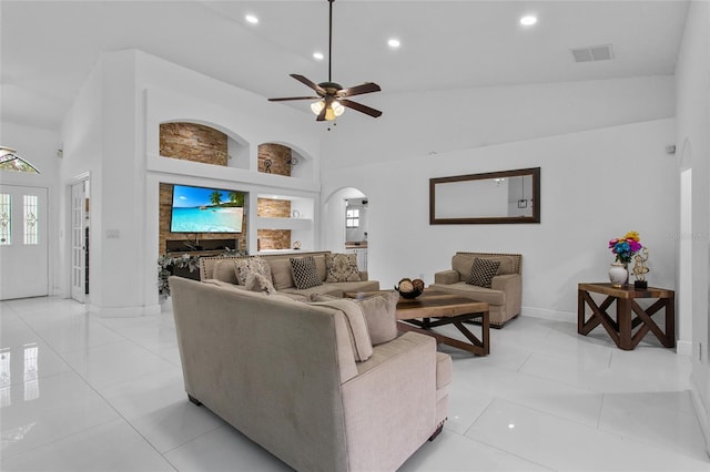 4905 Emilee Grace Ln, Saint Cloud, FL 34771 - living room featuring arched walkways, high vaulted ceiling, baseboards, a ceiling fan, and recessed lighting