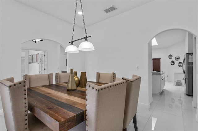 4905 Emilee Grace Ln, Saint Cloud, FL 34771 - dining area with arched walkways and baseboards