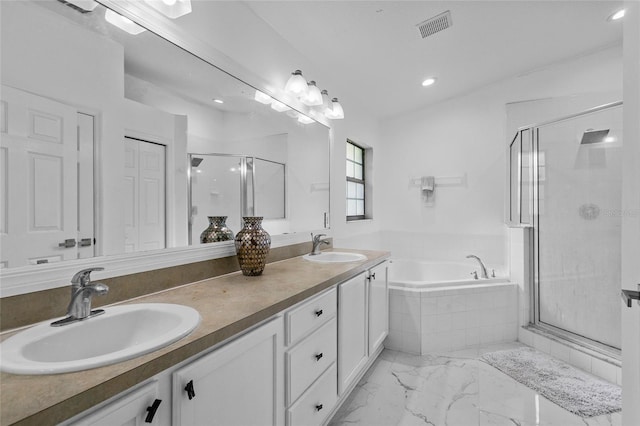 4905 Emilee Grace Ln, Saint Cloud, FL 34771 - full bathroom with a garden tub, a stall shower, double vanity, recessed lighting, and marble look tiles