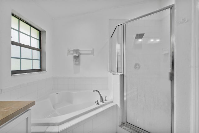 4905 Emilee Grace Ln, Saint Cloud, FL 34771 - bathroom with a garden tub, a shower stall, and vanity