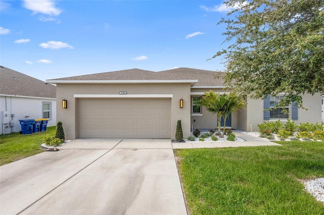 15356 White Tail Loop, Mascotte, FL 34753 - ranch-style house featuring a garage, stucco siding, concrete driveway, a front lawn, and a shingled roof