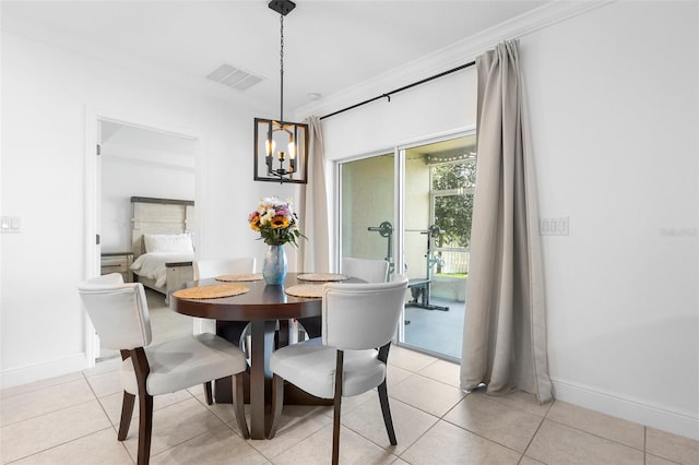 15356 White Tail Loop, Mascotte, FL 34753 - dining area with a chandelier, crown molding, baseboards, and light tile patterned flooring