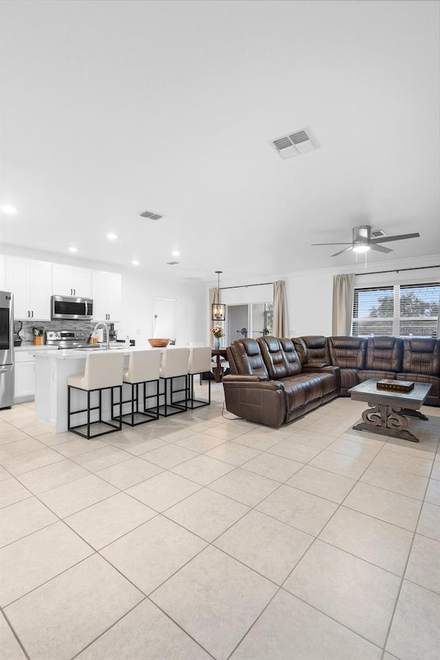 15356 White Tail Loop, Mascotte, FL 34753 - living room featuring a ceiling fan, light tile patterned floors, and recessed lighting