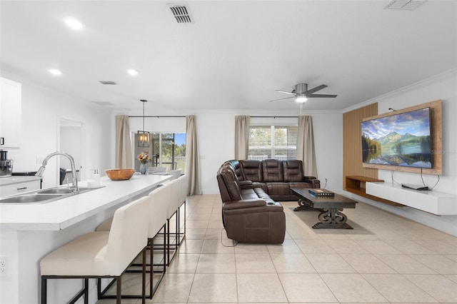 15356 White Tail Loop, Mascotte, FL 34753 - living area with crown molding, a ceiling fan, recessed lighting, and light tile patterned flooring