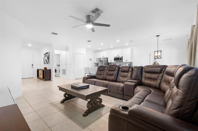 15356 White Tail Loop, Mascotte, FL 34753 - living area featuring light tile patterned flooring, ceiling fan, recessed lighting, washer / clothes dryer, and baseboards