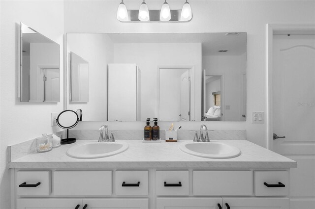 15356 White Tail Loop, Mascotte, FL 34753 - full bathroom with double vanity and ensuite bathroom
