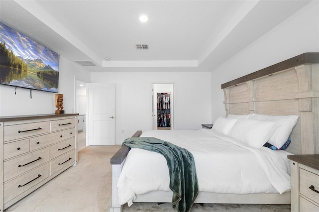 15356 White Tail Loop, Mascotte, FL 34753 - bedroom featuring a raised ceiling, light carpet, a spacious closet, and recessed lighting