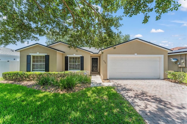 476 Basking Ridge Ct, Ocoee, FL 34761 - single story home with stucco siding, an attached garage, and driveway