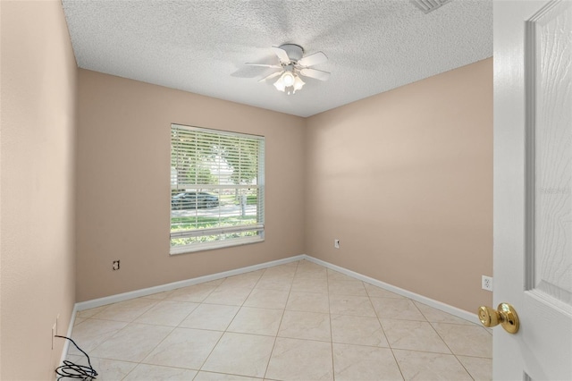 476 Basking Ridge Ct, Ocoee, FL 34761 - unfurnished room with ceiling fan, a textured ceiling, light tile patterned floors, and baseboards