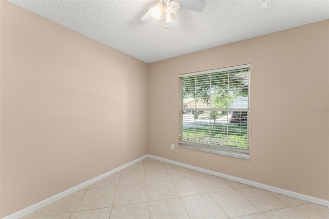 476 Basking Ridge Ct, Ocoee, FL 34761 - empty room with ceiling fan, a textured ceiling, baseboards, and light tile patterned floors