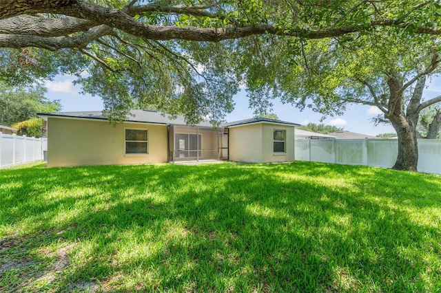 476 Basking Ridge Ct, Ocoee, FL 34761 - rear view of property featuring stucco siding and a sunroom
