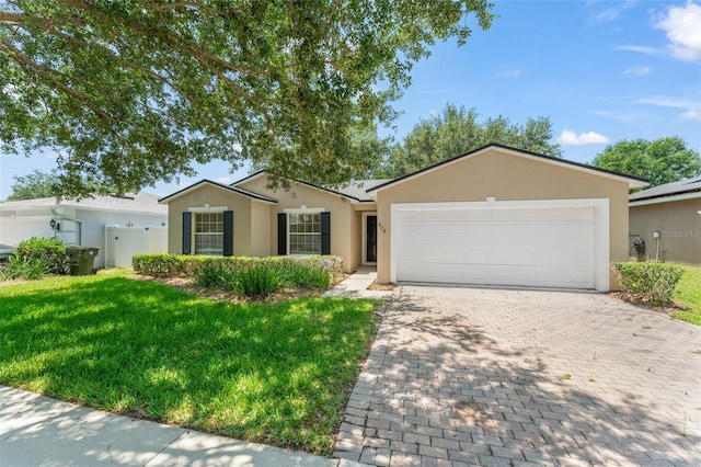 476 Basking Ridge Ct, Ocoee, FL 34761 - ranch-style home with stucco siding, decorative driveway, and an attached garage