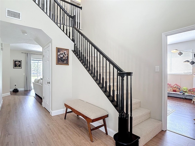 18109 Kara Ct, Tampa, FL 33647 - stairs featuring wood finished floors and baseboards