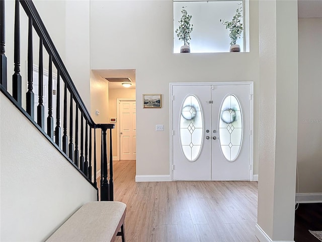 18109 Kara Ct, Tampa, FL 33647 - foyer featuring wood finished floors, stairs, baseboards, and a high ceiling
