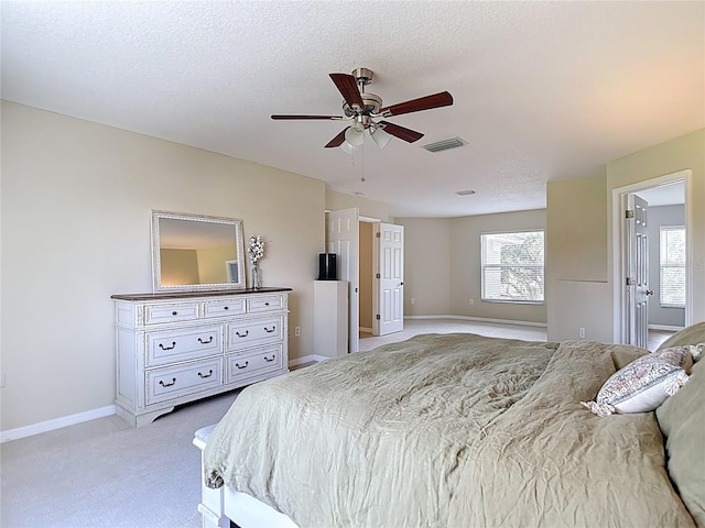 18109 Kara Ct, Tampa, FL 33647 - bedroom with light colored carpet, multiple windows, baseboards, and ceiling fan