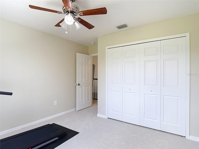 18109 Kara Ct, Tampa, FL 33647 - workout area with ceiling fan, light carpet, and baseboards