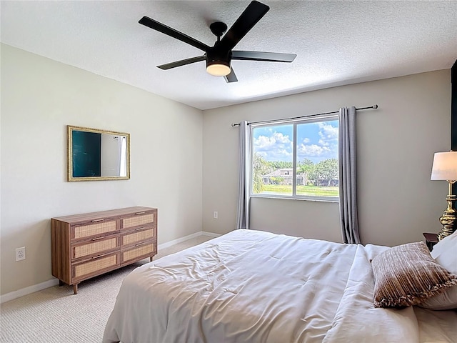 18109 Kara Ct, Tampa, FL 33647 - bedroom featuring baseboards, light colored carpet, a textured ceiling, and ceiling fan