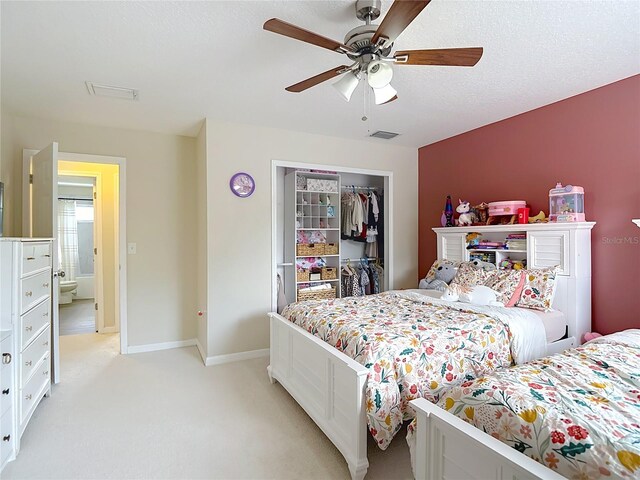 18109 Kara Ct, Tampa, FL 33647 - bedroom with light carpet, a closet, ceiling fan, and baseboards