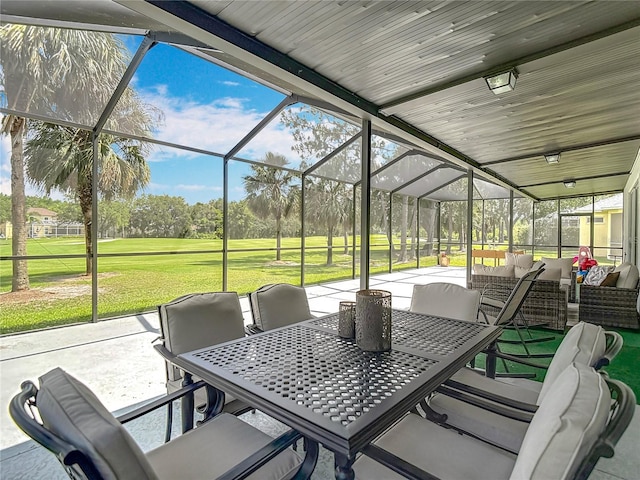 18109 Kara Ct, Tampa, FL 33647 - view of patio with an outdoor hangout area, glass enclosure, and outdoor dining area